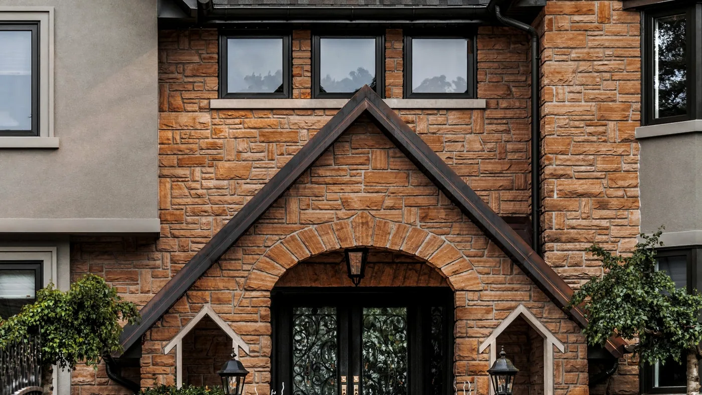 Brick home exterior with front door and windows