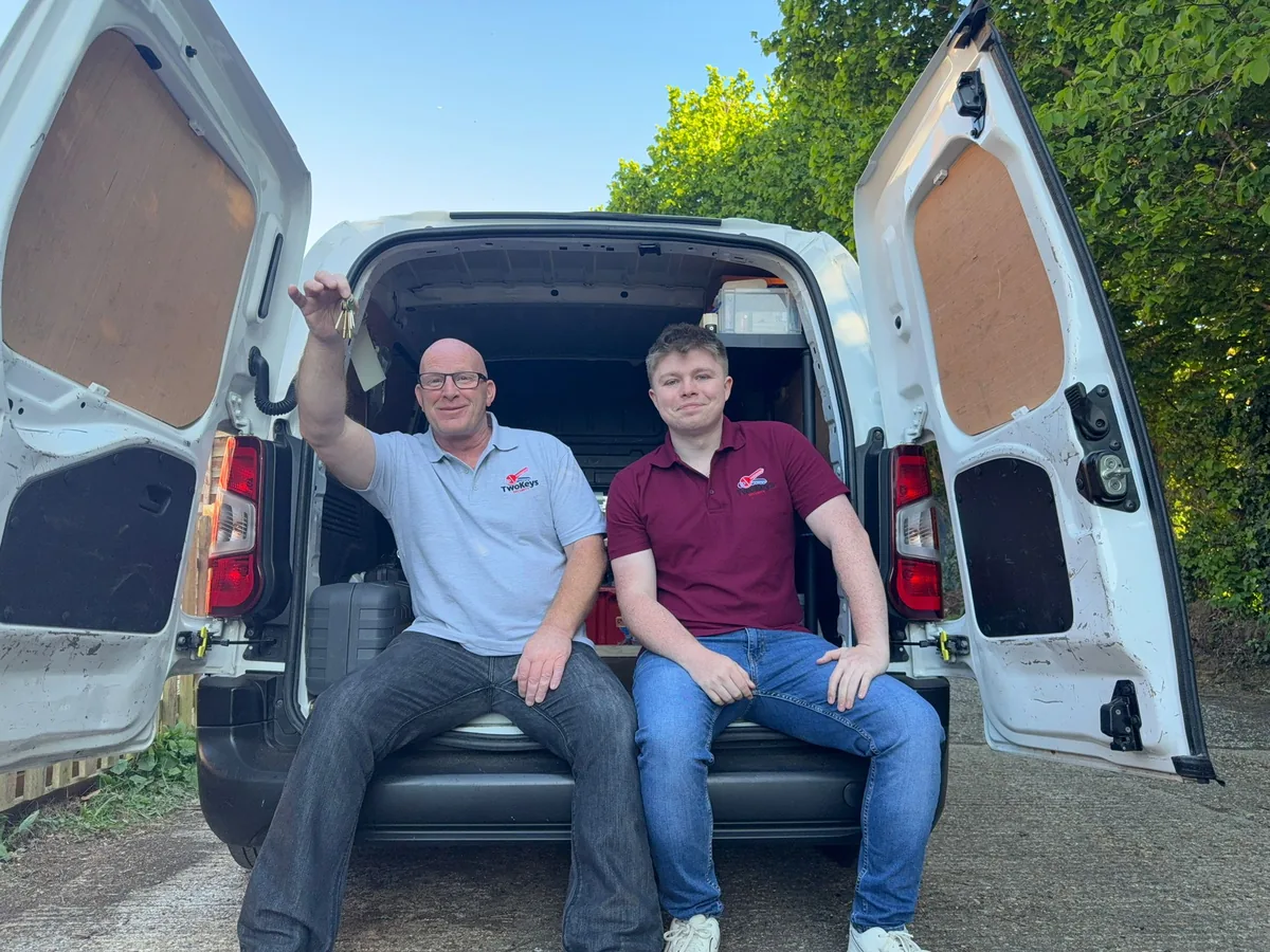 Jay and Justin from Two Keys Security standing outside their locksmith van